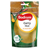 A 100g pack of Bodrum Spice Mild Curry Powder, an aromatic blend labeled "100% natural" and "No artificial colours or additives," featuring curry and spice images on its packaging.